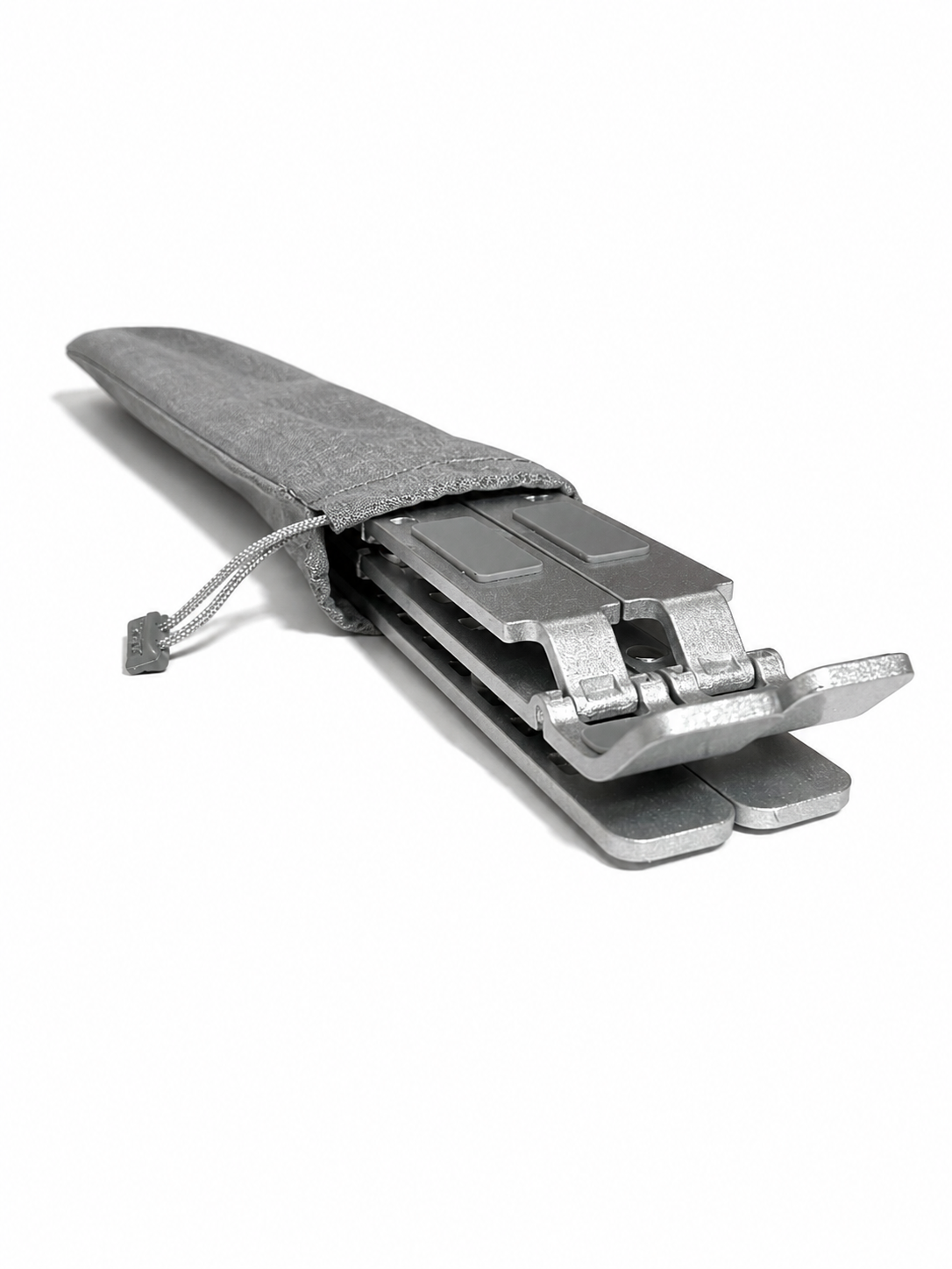 Stelo laptop stand sliding into protective carrying pouch